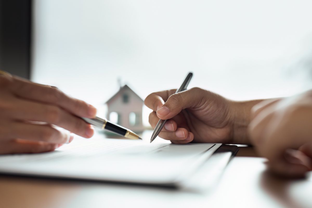 A tenant signing their condominium contract